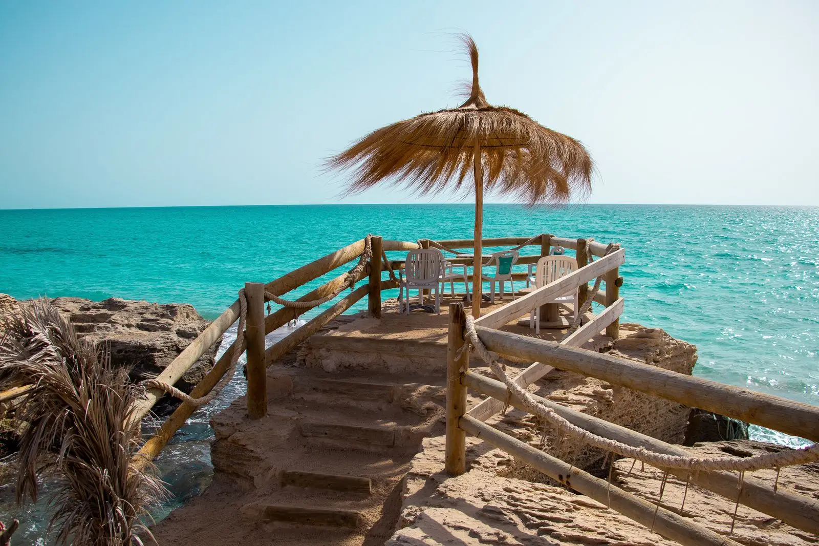 Deck overlooking turquoise waters in Mahdia, Tunisia